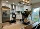 Bright kitchen featuring stainless steel appliances and white cabinetry at 10118 66Th Ave, Seminole, FL 33772