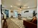 Open-concept living room with a view of the dining area and natural light at 10118 66Th Ave, Seminole, FL 33772