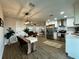Modern interior featuring an open-concept design connecting the living room, dining, and kitchen areas at 10118 66Th Ave, Seminole, FL 33772