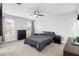 Comfortable carpeted bedroom with a ceiling fan, two windows and neutral decor for a relaxing atmosphere at 1034 Grantham Dr, Sarasota, FL 34234