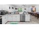Bright kitchen featuring stainless steel appliances, granite counters, and open layout at 1034 Grantham Dr, Sarasota, FL 34234