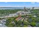 An aerial view shows the property's location near a bustling highway, surrounded by lush greenery and cityscapes at 1118 S Moody Ave, Tampa, FL 33629