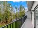 Balcony overlooking backyard with lush greenery at 1118 S Moody Ave, Tampa, FL 33629