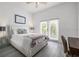 Comfortable bedroom with ceiling fan, natural light, and minimalist design at 1118 S Moody Ave, Tampa, FL 33629