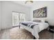 Bright bedroom with ceiling fan, natural light, and artwork at 1118 S Moody Ave, Tampa, FL 33629
