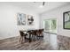 Dining room with modern light fixture, large windows, and artwork at 1118 S Moody Ave, Tampa, FL 33629