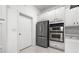 Kitchen with stainless steel refrigerator and double oven appliance at 1118 S Moody Ave, Tampa, FL 33629