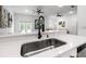 Kitchen with quartz countertops, and a stainless steel faucet and stainless appliances at 1118 S Moody Ave, Tampa, FL 33629