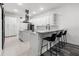 Modern kitchen features an island with seating, stainless steel appliances, and ample storage space at 1118 S Moody Ave, Tampa, FL 33629