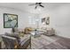 Bright living room with stylish modern decor, large windows and comfortable seating for entertaining at 1118 S Moody Ave, Tampa, FL 33629