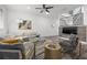 Open living room design features stylish décor, a modern fireplace and a beautiful staircase at 1118 S Moody Ave, Tampa, FL 33629