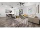 Open-concept living room featuring modern decor, a stylish rug, and plenty of natural light at 1118 S Moody Ave, Tampa, FL 33629