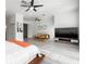 Bright main bedroom featuring ceiling fan and a tv console with tv at 1118 S Moody Ave, Tampa, FL 33629