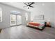 Main bedroom featuring windows, a ceiling fan and en-suite bathroom at 1118 S Moody Ave, Tampa, FL 33629