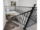 Staircase with decorative metal railings and wood steps at 1118 S Moody Ave, Tampa, FL 33629