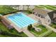 Aerial view of community pool with lounge chairs and outdoor recreation area at 12515 Horseshoe Bend Dr, Lithia, FL 33547