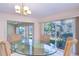 Bright dining room with backyard view and modern chandelier at 1655 S Highland Ave # B110, Clearwater, FL 33756