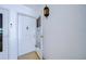 Welcoming entryway with classic light fixture, security door, and neutral decor at 1655 S Highland Ave # B110, Clearwater, FL 33756