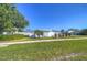 Charming single-story home with patterned facade, manicured lawn and mature landscaping at 1655 S Highland Ave # B110, Clearwater, FL 33756