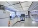 Bright kitchen with white appliances, window and tile backsplash at 1655 S Highland Ave # B110, Clearwater, FL 33756