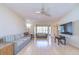 Bright, airy living room with tile floors, neutral walls, and seamless flow to adjacent spaces at 1655 S Highland Ave # B110, Clearwater, FL 33756