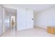 Bright living room featuring tile floors, neutral paint, and a glimpse into the adjacent rooms at 1655 S Highland Ave # B110, Clearwater, FL 33756