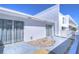 Private patio area with sliding glass doors and a low-maintenance rock garden at 1655 S Highland Ave # B110, Clearwater, FL 33756