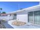 Spacious patio with partial fence, featuring sliding glass doors and decorative rock detail at 1655 S Highland Ave # B110, Clearwater, FL 33756
