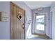 Community sauna room featuring wood door and exit to pool area at 1655 S Highland Ave # B110, Clearwater, FL 33756