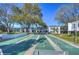Wide shot of community shuffleboard courts with residential buildings at 1655 S Highland Ave # B110, Clearwater, FL 33756