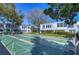 Community shuffleboard court featuring multiple courts and mature trees at 1655 S Highland Ave # B110, Clearwater, FL 33756