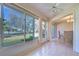 The sun room features lots of light and glass doors to the exterior and a dining area at 1655 S Highland Ave # B110, Clearwater, FL 33756