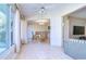 A view of the sun room leading to the dining room and a peek into the living room at 1655 S Highland Ave # B110, Clearwater, FL 33756