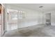 Open-concept living area with ample space and bright light, connects to the adjacent kitchen and dining area at 1910 Rainbow Dr, Clearwater, FL 33765
