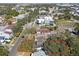 Aerial view of a property surrounded by mature trees in a developed urban area at 306 S Albany Ave, Tampa, FL 33606