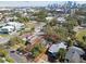 Aerial view of a residential area showcasing a property lot outlined in red with city skyline in the background at 306 S Albany Ave, Tampa, FL 33606