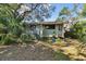 Cozy backyard with lush, shady landscaping provides a private outdoor space at 306 S Albany Ave, Tampa, FL 33606