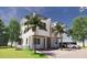 Rendering of a modern three-story home featuring balconies, a two-car garage, with stone accents and manicured landscaping at 306 S Albany Ave, Tampa, FL 33606