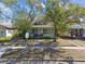 Charming two-story craftsman home featuring a covered front porch with classic columns and a well-manicured front lawn at 306 S Albany Ave, Tampa, FL 33606