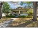 Charming two-story craftsman home featuring a covered front porch with classic columns and a well-manicured front lawn at 306 S Albany Ave, Tampa, FL 33606