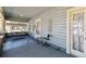 Comfortable front porch with wood flooring, swing and lots of space for sitting and enjoying the outdoors at 306 S Albany Ave, Tampa, FL 33606