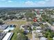 Charming home with a well-maintained yard, community park, and a serene lake view from above at 3106 Lila St, Tampa, FL 33610