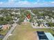 Aerial view of the neighborhood, showcasing the home's location near a park with playground and a basketball court at 3106 Lila St, Tampa, FL 33610