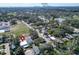 Scenic aerial view of a home near a park and lake, offering a blend of urban and natural beauty at 3106 Lila St, Tampa, FL 33610