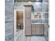 Beautiful bathroom showcases unique stone walls, vanity with storage, and a modern mirror at 3106 Lila St, Tampa, FL 33610