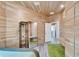 Bedroom with hardwood paneled walls, mirror and modern style furnishings at 3106 Lila St, Tampa, FL 33610