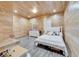 Bright bedroom with wood-paneled walls, a cozy bed, and unique hanging desk feature at 3106 Lila St, Tampa, FL 33610