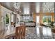 Wide angle photo showing dining room, kitchen and living areas with bright decor and natural light at 3106 Lila St, Tampa, FL 33610