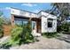 Charming home featuring modern brickwork, wood accents, neat landscaping, and a stylish brick driveway at 3106 Lila St, Tampa, FL 33610