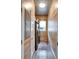Efficient laundry room features wood paneling, gray floors, and modern stainless steel appliances for added convenience at 3106 Lila St, Tampa, FL 33610